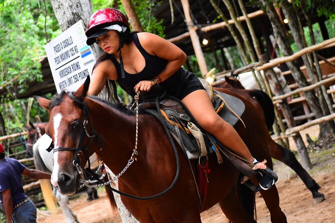 4 activities in 1 Horse Riding, ATV Shared, Cenote & Ziplines from Cancún - Cooling off in a freshwater cenote