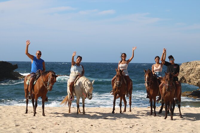 Aruba North Coastline: Small-Group Horseback Riding Tour - Wariruri Bay, beach sand, and the baby natural bridge