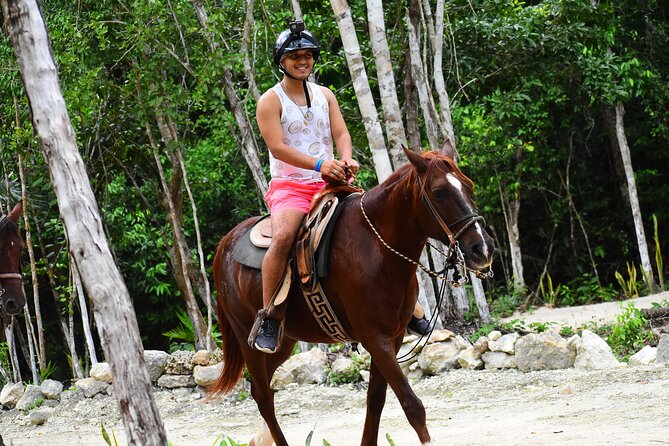 ATV (shared), Horse Back Riding, Ziplines, & Cenote from Cancún - A semi-open cenote for swimming and cooling off