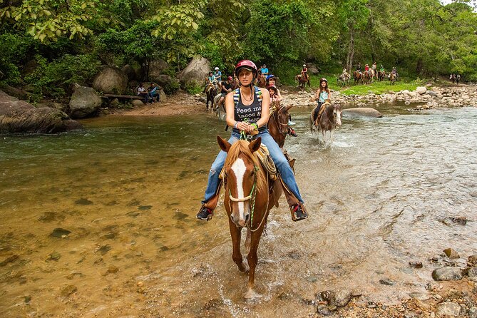 Combo Horseback Riding in Vallarta with ATV and Ziplines. - Horseback riding through rivers and jungle