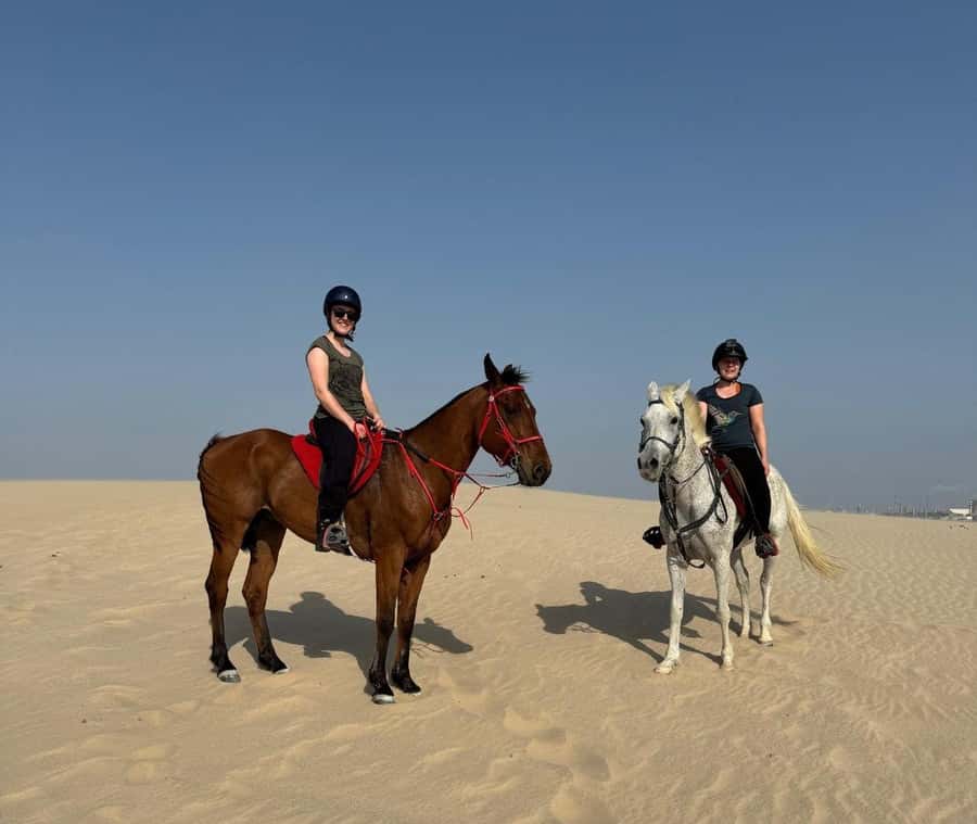 Doha Horseback Riding Adventure in Desert with Transfers - Riding an Arabian horse beyond Doha