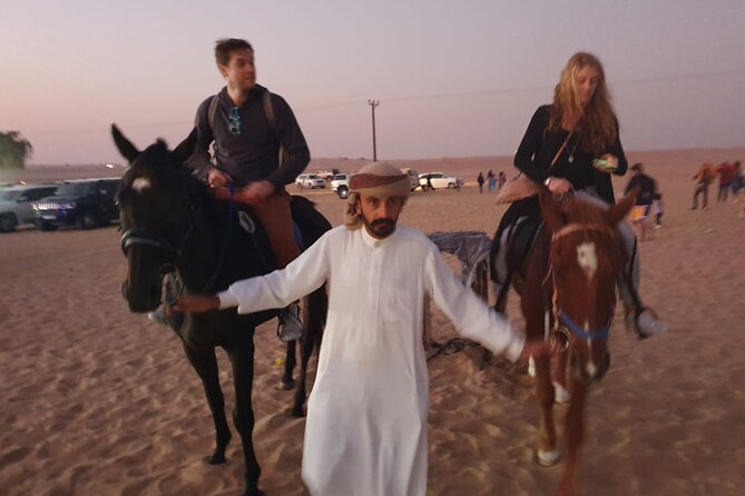 Dubai: All Inclusive Desert Safari with ATV, Camel, Horse ride, Vip & more - Sandboarding and the sunset photo stop