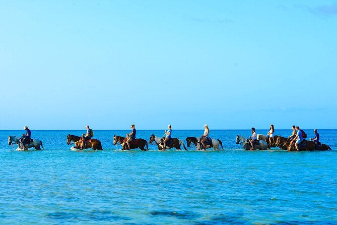 Group Beach and Ocean Horseback Adventure in Providenciales - Riding straight into the Providenciales surf