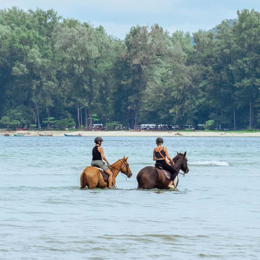 Phuket Beach Horseback Adventure - Riding beneath the planes at Nai Yang Beach