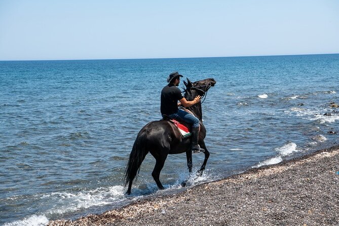 Premium Secluded Black Beach Horseback Riding Tour in Santorini - Volcanic ravines, caves, and the little church