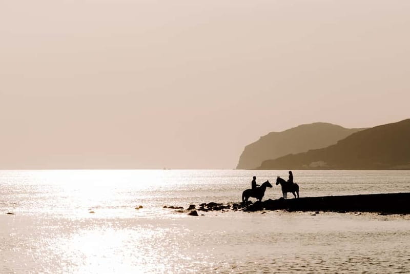 Santorini: Horseback Riding on the Black Sandy Eros Beach - Sunset, heat, and the best time to ride